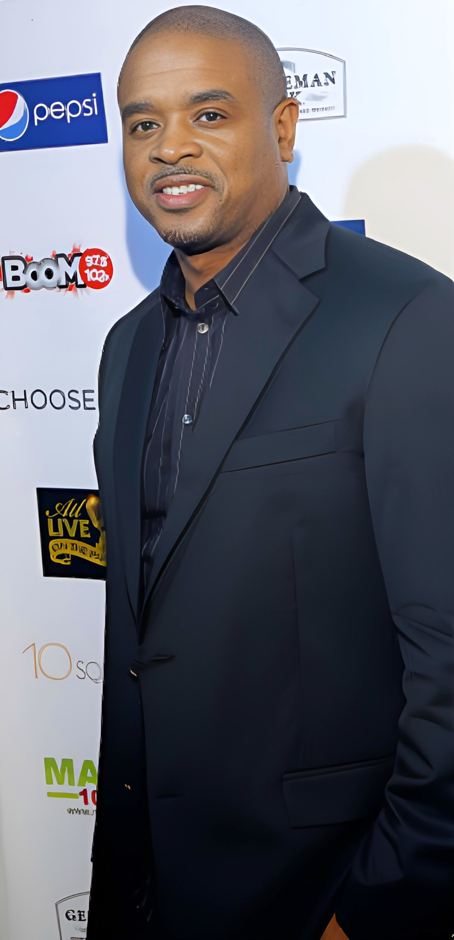 Eddie F smiling on the red carpet